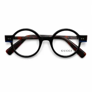 Monture Gucci ronde noire en acétate avec branches effet écaille