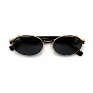 Lunettes de soleil Fendi FF Diamonds de forme ronde en acétate noir et métal doré, présentées devant leur coffret jaune iconique Fendi Roma.