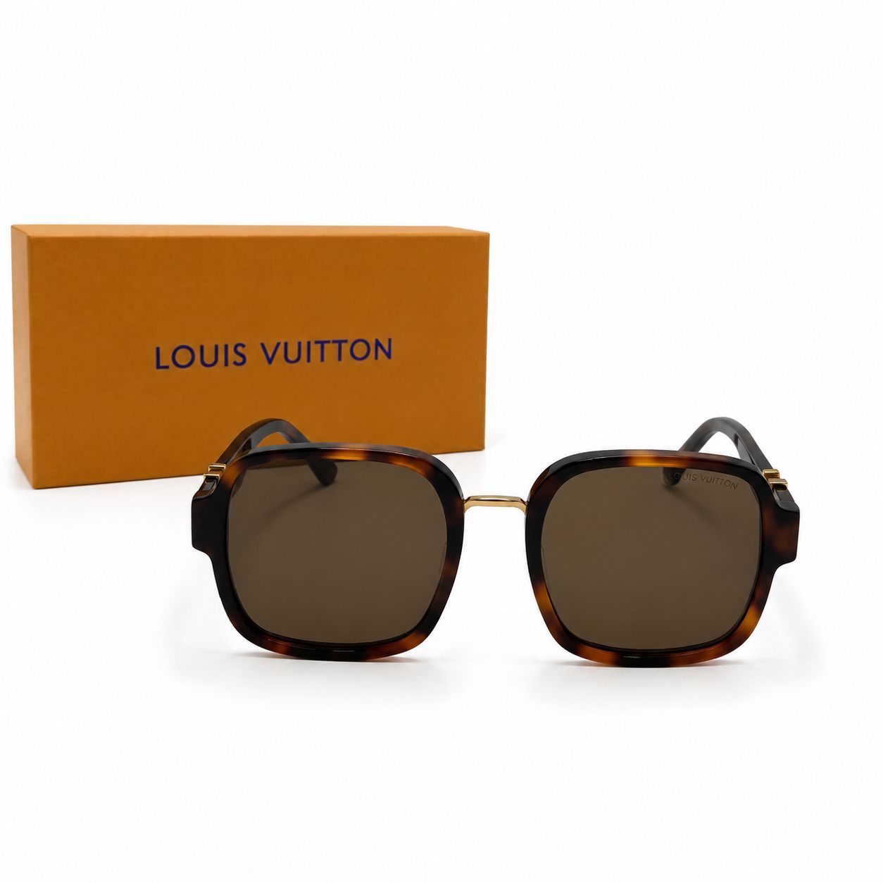 Lunettes de soleil de luxe pour homme Louis Vuitton avec monture carrée épaisse en acétate écaille de tortue et verres teintés bruns foncés.